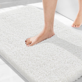 Yimobra non-slip 36x24 bathroom rug on tile for secure footing.