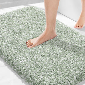 Yimobra light-green rug with non-slip hexagon bottom for safer bathroom floors.