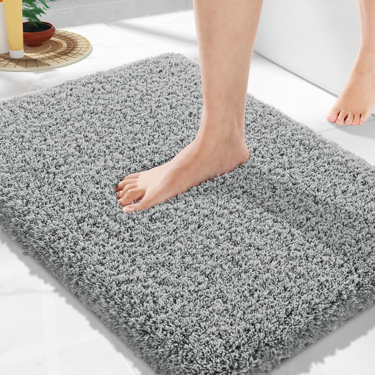 Yimobra bath rug with non-slip TPR bottom prevents slips for safer bathroom floors.