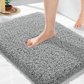 Yimobra bath rug with non-slip TPR bottom prevents slips for safer bathroom floors.