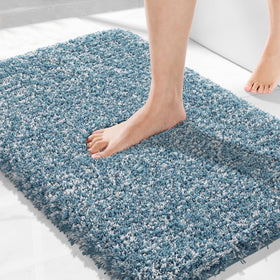 Yimobra denim blue bath rug 32x20 offers plush comfort and quick drying after showers.