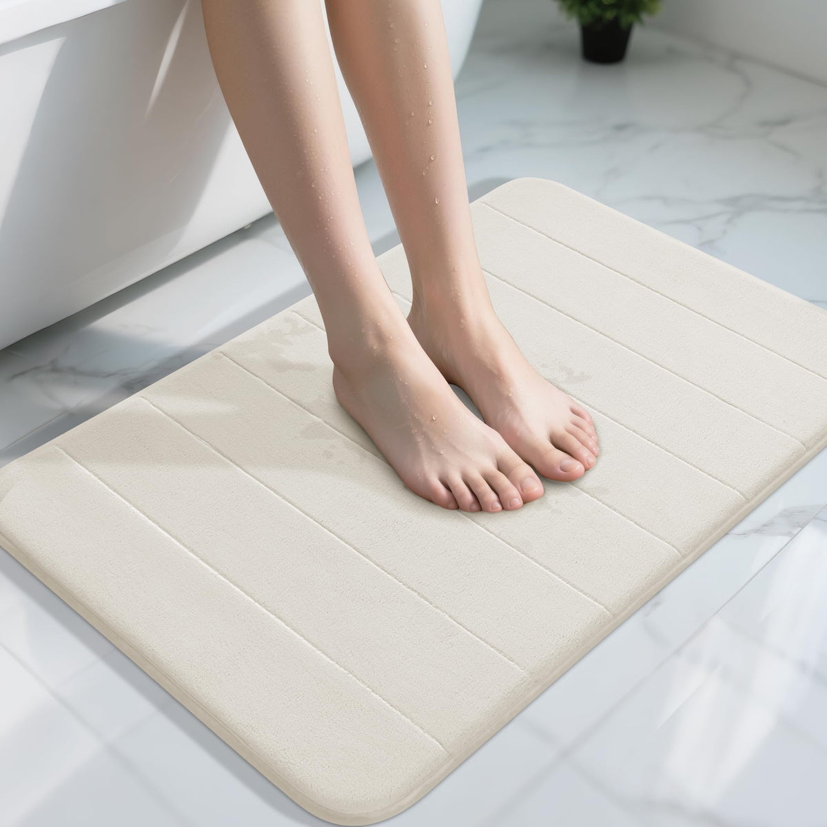 Yimobra memory foam bath mat cloud-soft surface for plush foot comfort after showers.