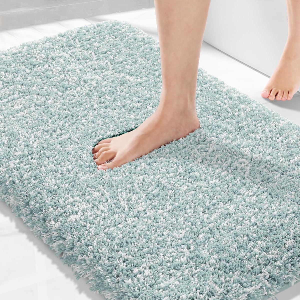 Yimobra sky light blue and white rug adds calm color to bath