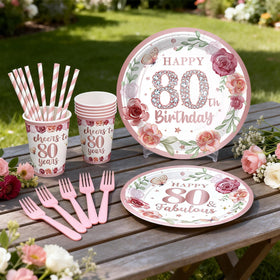 Yingoto 80th birthday napkins in rose gold complete a coordinated table setting.