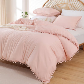 YIRDDEO Twin Comforter Set with ball pom fringe on the bed for a playful look