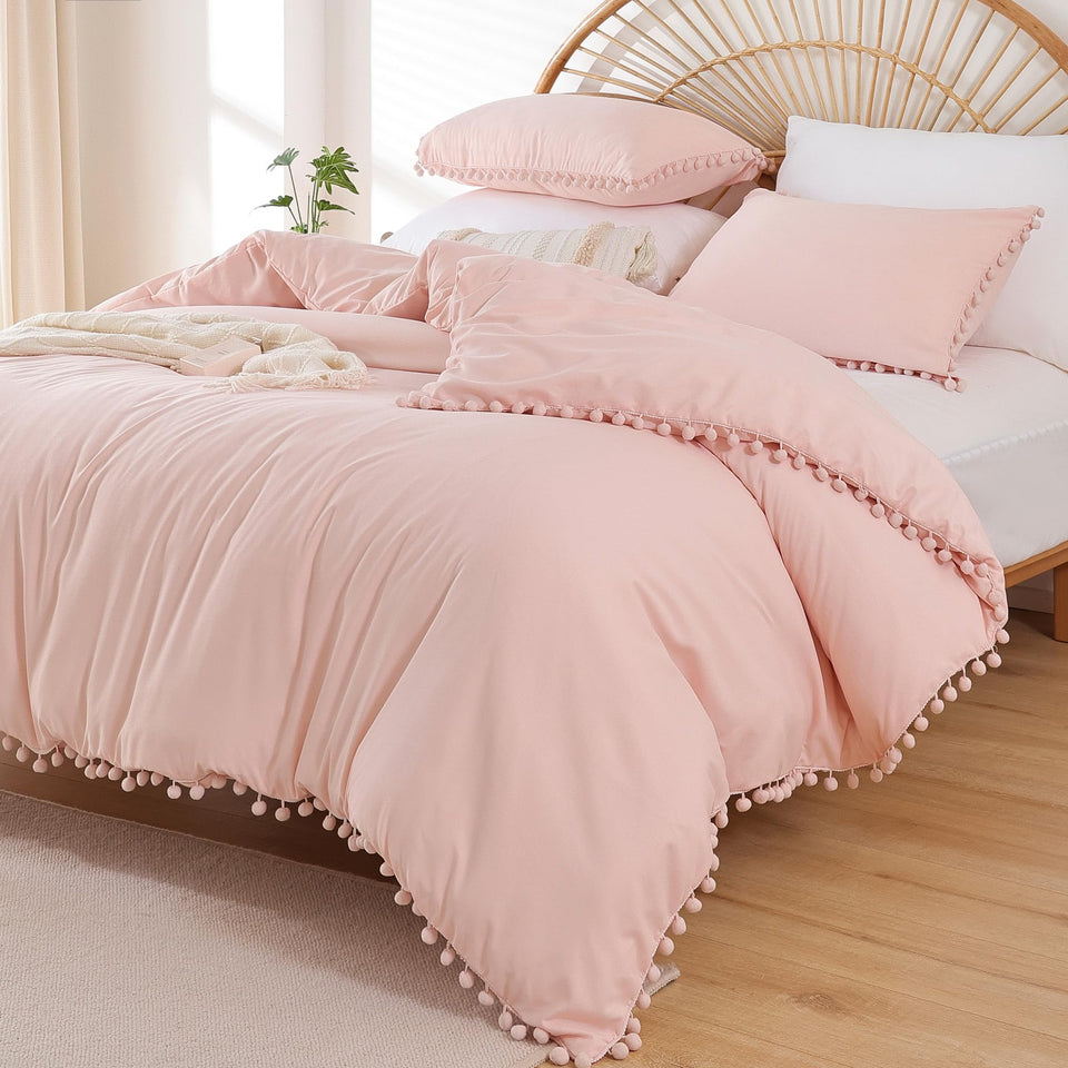 YIRDDEO Twin Comforter Set with ball pom fringe on the bed for a playful look