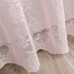 Bathroom styling with pink lace shower curtain for romantic ambiance