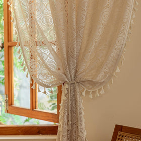 See-through sheer drapes offering light diffusion and privacy.