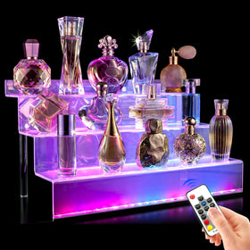 YMVV 12-inch clear acrylic LED display riser highlights cosmetics with vibrant lighting