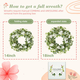 White flower accents on YNYLCHMX wreath add delicate seasonal detail