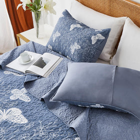 Butterfly leaves print on quilt with two matching shams.