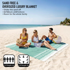 Yongoes soft sand-free Turkish cotton blanket laid on the sand for easy lounging.
