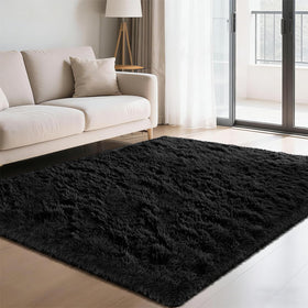 Yongyangjuxin fluffy shag rug in black 4x6 enhances cozy living room ambiance.