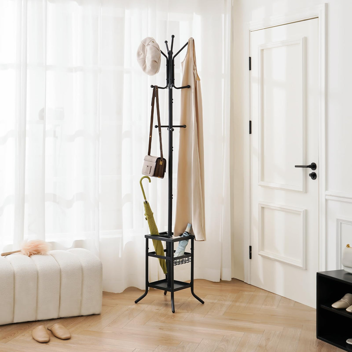 Yoobure coat rack umbrella holder keeps umbrellas dry and reachable.