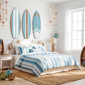 Yookeer blue surfboard wall art in a tropical living room setting