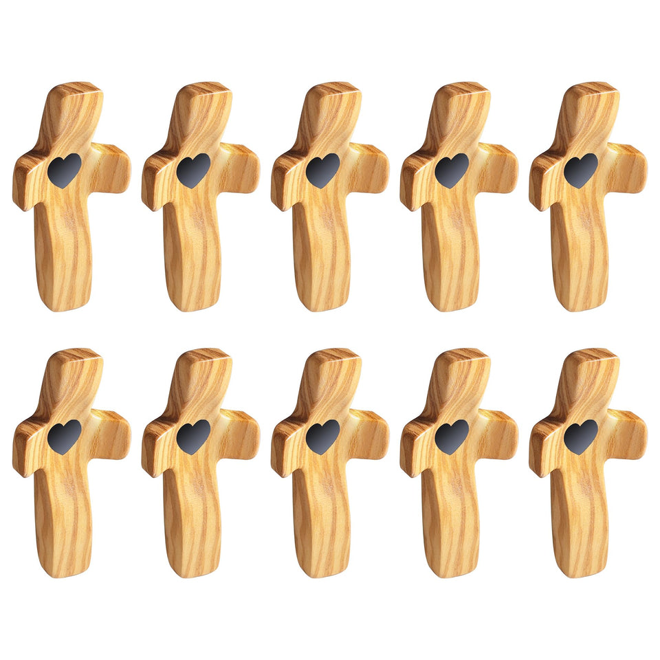 Yookin olive wood cross fidget in pocket-prayer pose for calm focus.
