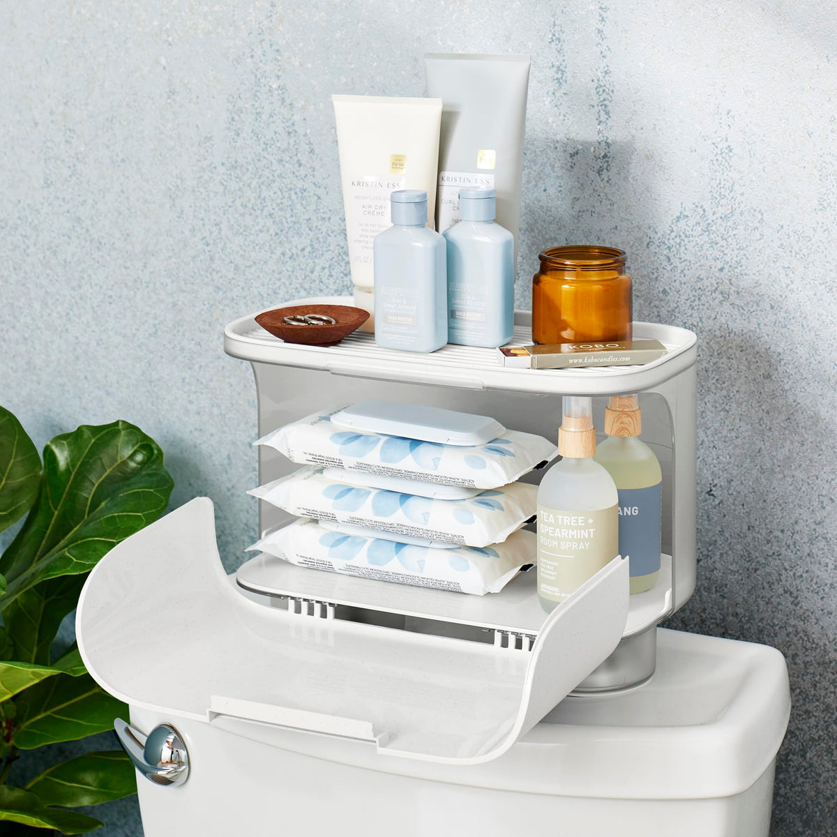 YouCopia Hideaway suction cups gripping a flat tank lid for stability
