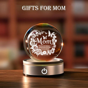 YouerCrystal crystal on wooden base glows with a warm, decorative light.