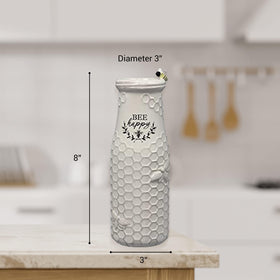 Young's Inc Vase with flowers display on table creates spring-inspired charm.