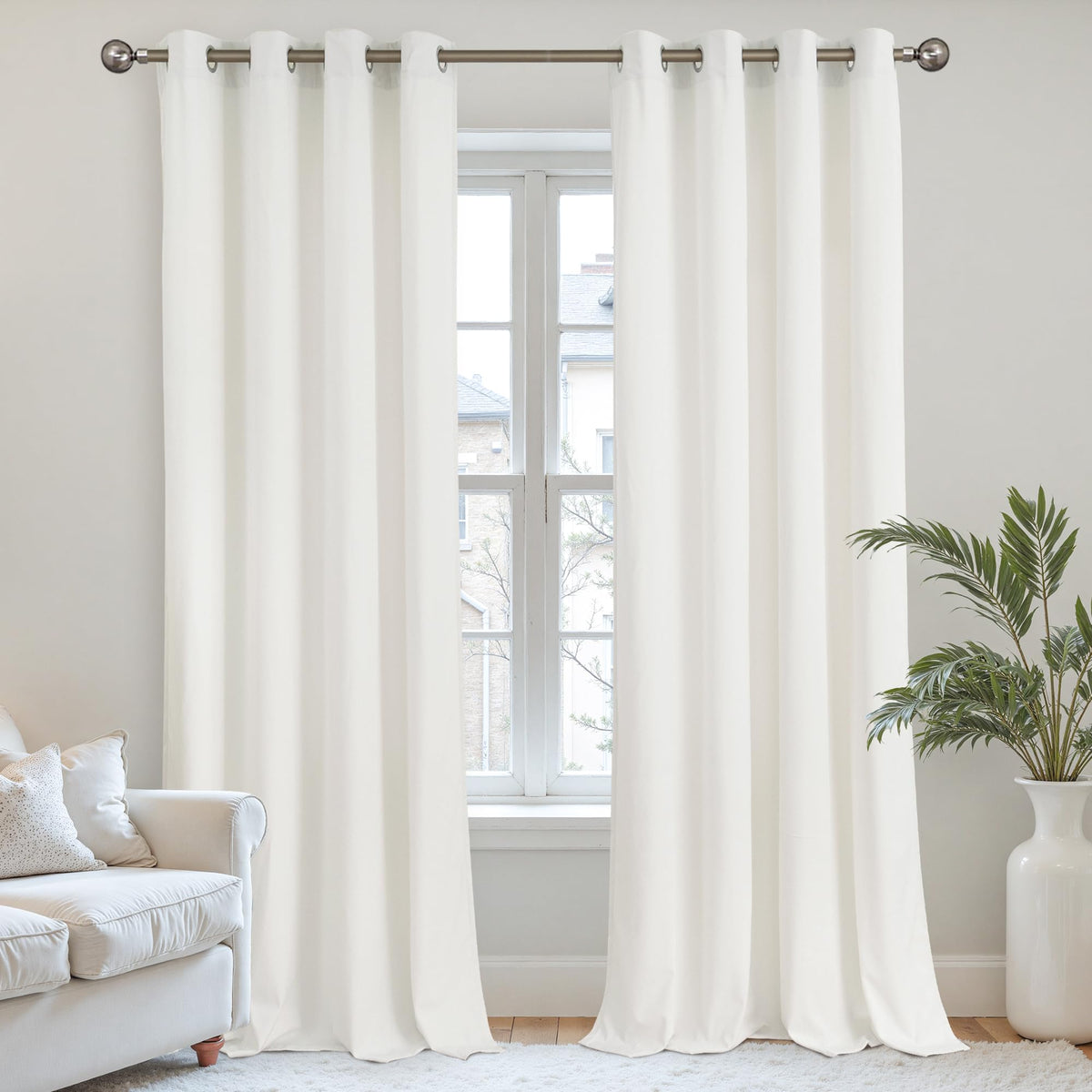 YoungsTex Ivory White Velvet Curtains in 84 inches provide privacy and subtle room-darkening.