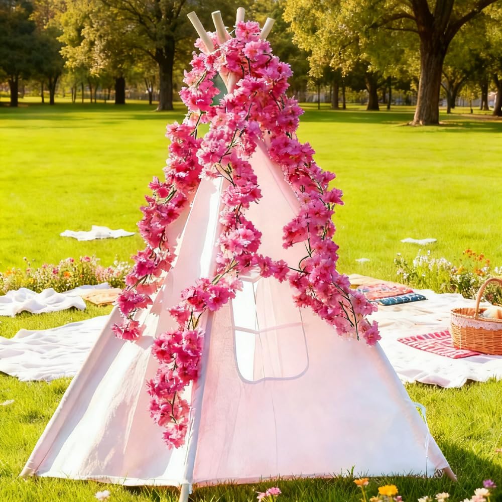 YRIOWMI arch drape with cherry blossoms creates a romantic backdrop.