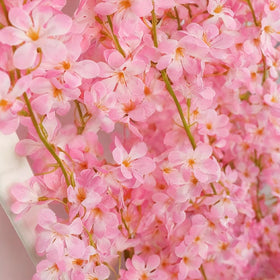YRIOWMI garland displayed as a lush arch backdrop for photos