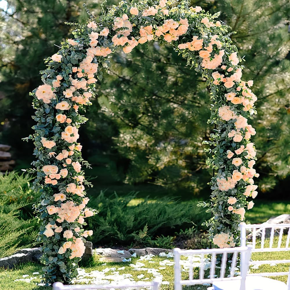 YRIOWMI rose vine wedding arch setup with champagne-tone blooms