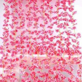 YRIOWMI wedding backdrop using cherry blossom garlands adds elegant ambiance.