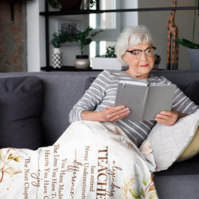 The YSBLGWE watercolor flowers blanket brings a graceful touch to a home office.