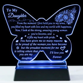 YWHL keepsake displayed on a table with soft illumination