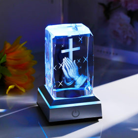 Laser-engraved praying hands cross detail on clear crystal by YWHL
