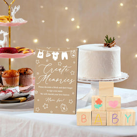 ZCPTZ gender reveal party setup with sign prompts for guest participation.