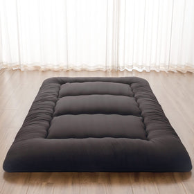 Zelladorra Japanese floor mattress rolled for storage, ideal for camping