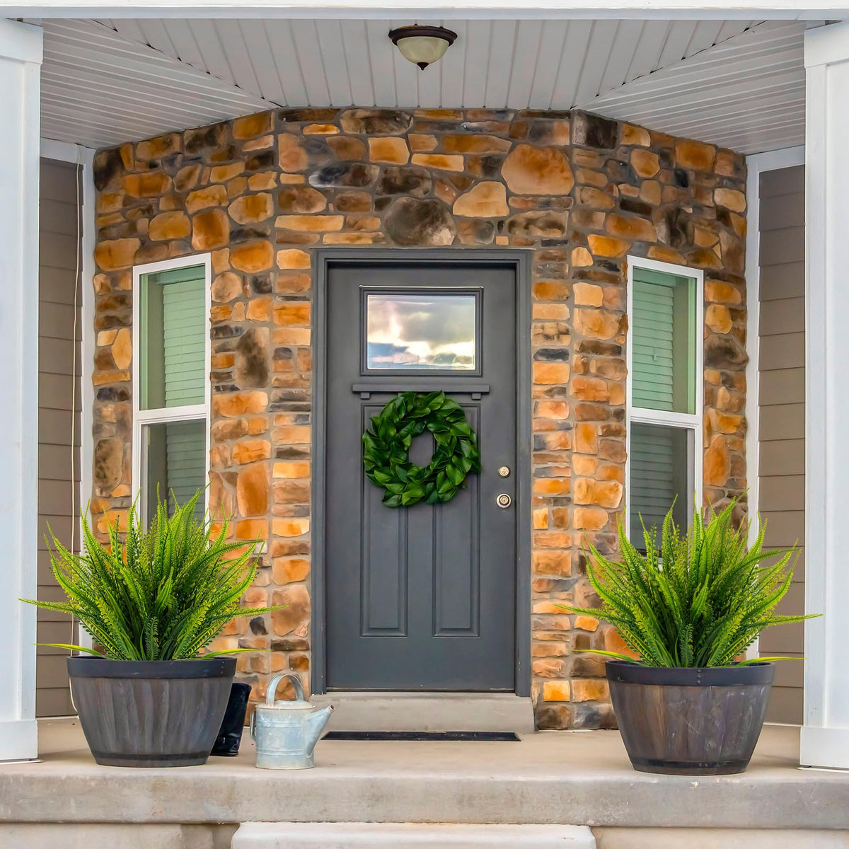Bright green Boston fern arrangement hanging gracefully to enhance a patio or window box.