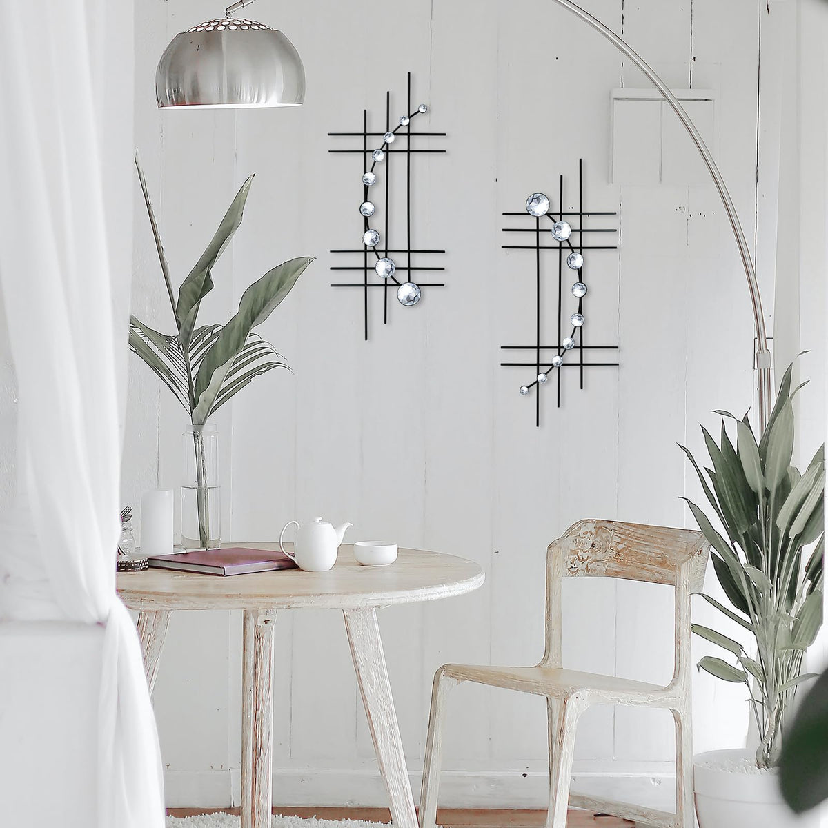 ZEXUIRU silver-finish abstract metal art adds contemporary shimmer