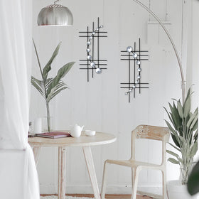 ZEXUIRU silver-finish abstract metal art adds contemporary shimmer