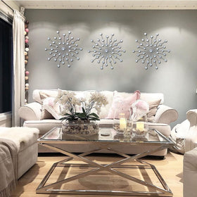 ZEXUIRU silver starburst wall art detail with rhinestones and teardrop accents.