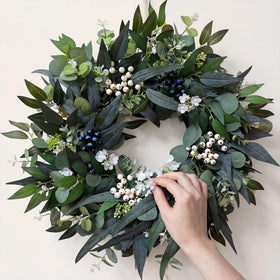 Zhoree eucalyptus wreath brightening living room or fireplace mantel.