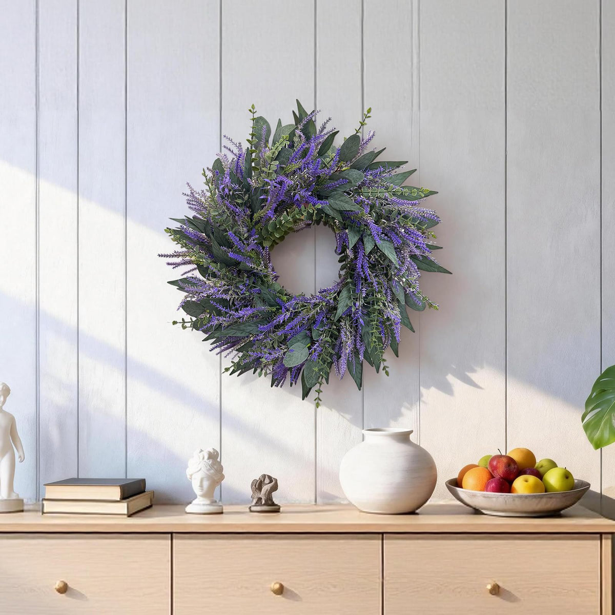 Zhoree lavender eucalyptus wreath used as a wedding backdrop accent.