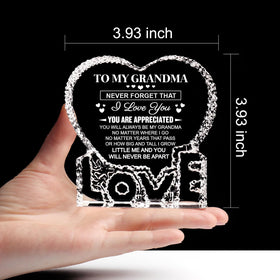 ZHSHWAT heart crystal on its sturdy base for desk or mantel display.