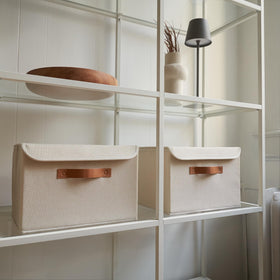 ZICOTO decorative storage boxes on shelves beside books create elegant organization.