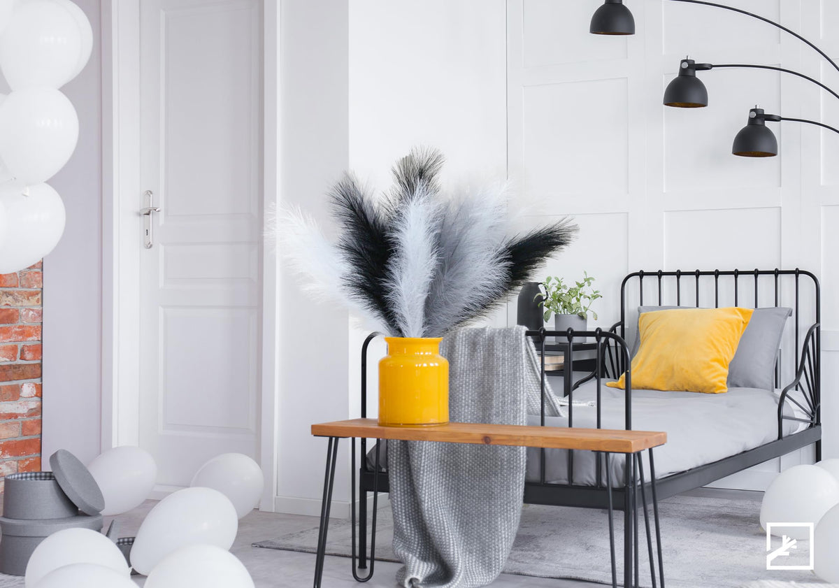 ZIFTY farmhouse fireplace vignette featuring tall pampas grass.