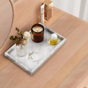 Zilukar marble tray with candles and perfumes enhancing ambience.