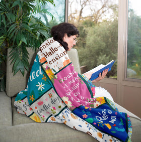 Zolumy blanket by the bed offers soft warmth for lounging at home.