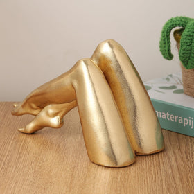 Zonsuli Golden Legs sculpture with porcelain-look finish complements coffee tables and shelves.