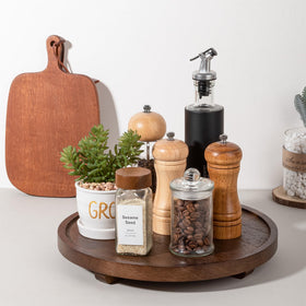 Zoocatia tray showcases perfume bottles in a tidy bathroom vanity.