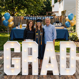 ZPISF LED light strings illuminate the GRAD letters with a soft glow.