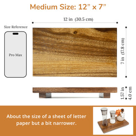 Zurklulu acacia riser on kitchen counter elevates spices and jars.