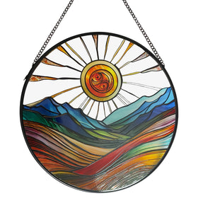 ZUSANG Sun Mountains sun catcher in a window with vibrant colors.